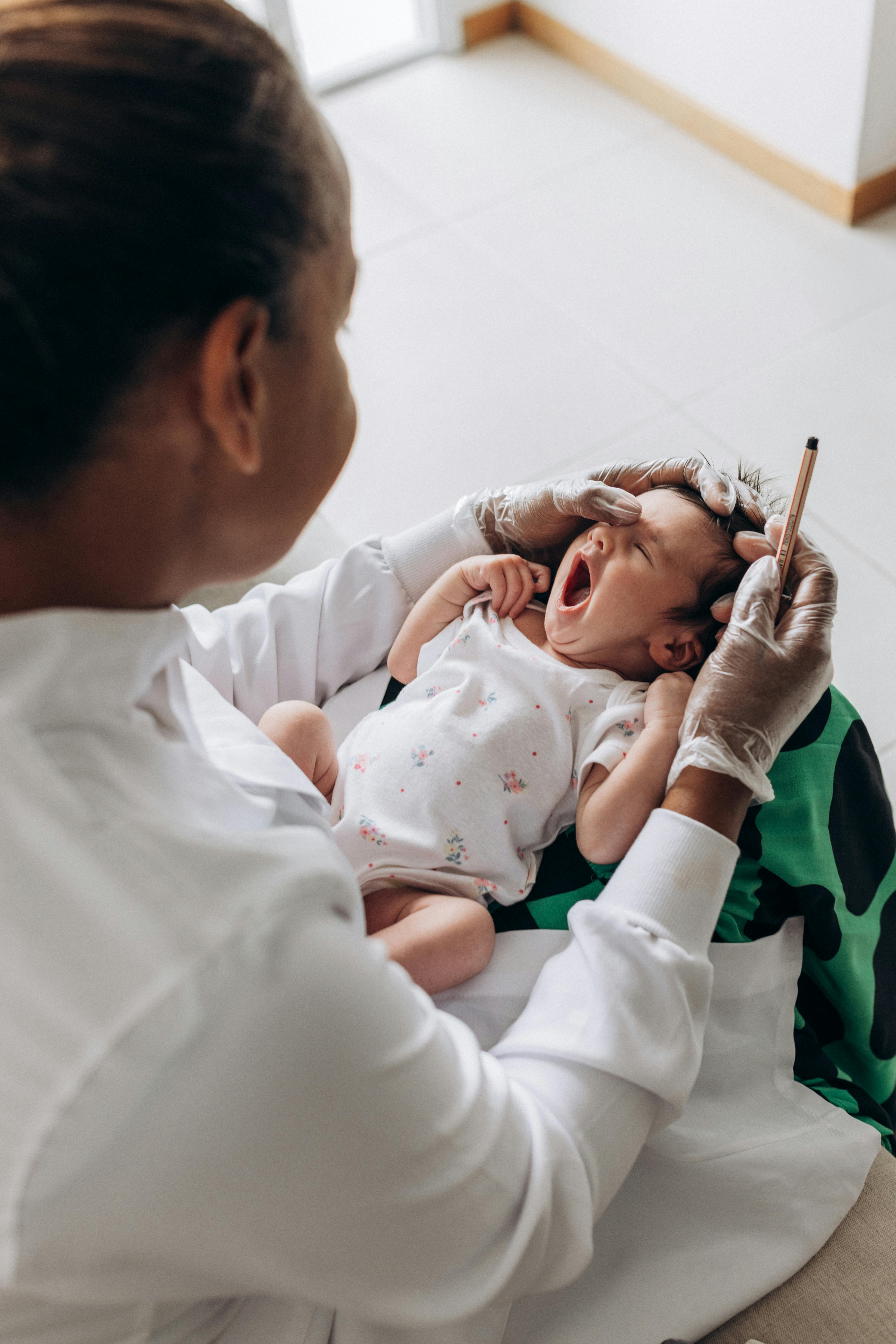 Infant gas holding a syringe